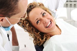 lady smiles at dentist