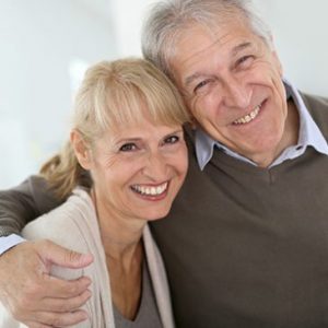 couple with dental implants