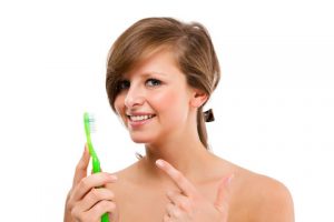 woman with toothbrush