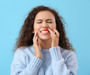 woman with gum pain