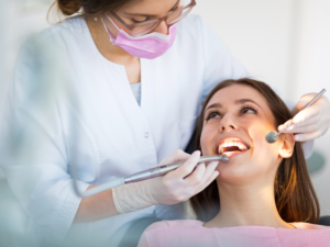 dentist checking a woman's teeth